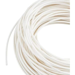 May include: A close-up shot of a coil of white rope. The rope is tightly wound, with each strand visible. The texture appears smooth, and the color is a bright, clean white. The rope is likely used for crafting or general use.