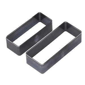 May include: Two rectangular metal leather craft tools with a hollow center. The tools are dark gray and have a sharp, beveled edge. The tools are designed for cutting leather and other materials.