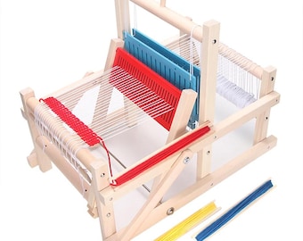 May include: Wooden loom with red, blue, and white yarn. The loom has a wooden frame and a red and blue plastic shuttle. 