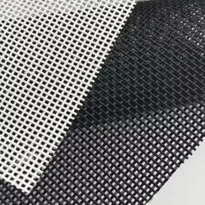 May include: A dual-layered mesh fabric featuring a white grid pattern on one side and a black grid pattern on the other. The material consists of evenly spaced, perpendicular woven strands creating a consistent square opening throughout the surface.