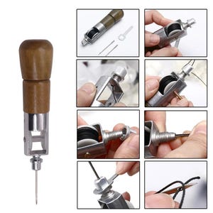 May include: A close-up of a leather sewing awl with a wooden handle and a metal needle. The awl has a built-in threader and a spool of thread. The awl is used for sewing leather and other thick materials.