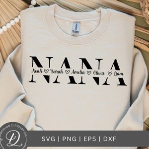 May include: A beige sweatshirt with the word "NANA" in black block letters. Below the letters are the names "Noah", "Sarah", "Amelia", "Olivia", and "Liam" with a heart symbol between each name.
