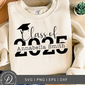 May include: A white sweatshirt with black text that reads "Class of 2025 Annabella Smith". A graduation cap is above the text.
