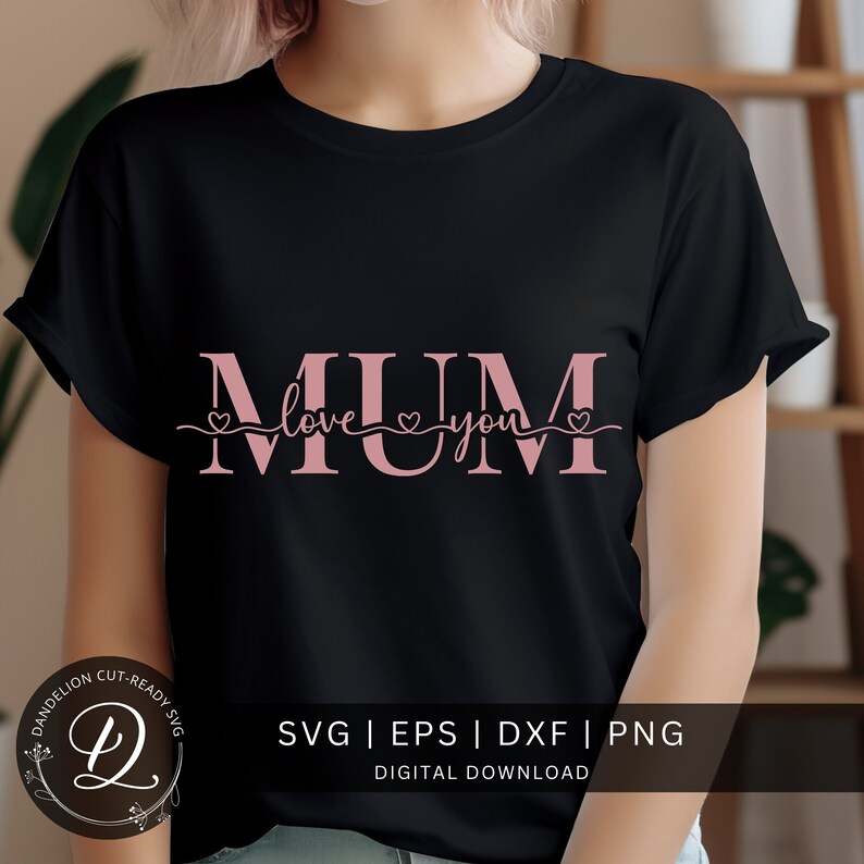 May include: A black t-shirt with a pink design that says "MUM love you" with hearts on either side of the word "love".