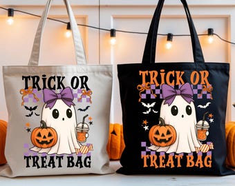 May include: Two Halloween-themed tote bags. One is off-white, the other black. Each features a cartoon ghost with a purple bow, a jack-o'-lantern, and the text "Trick or Treat Bag". The bags have long handles and are perfect for trick-or-treating.