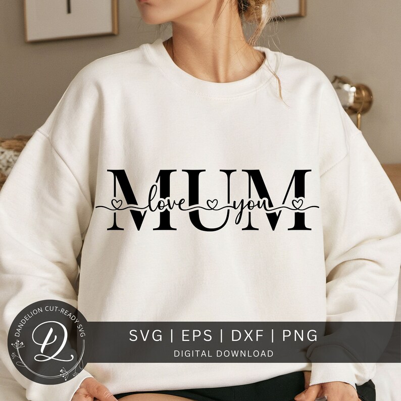 May include: A white sweatshirt with the text "MUM" in black with a heart and the words "love you" underneath.
