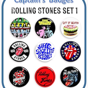 May include: Nine round button badges featuring various Rolling Stones designs. The designs include a group photo, a band logo, a tongue and lips logo, a cake, and a dog.