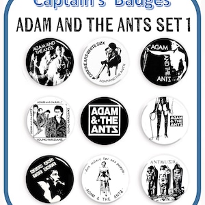 May include: Set of nine black and white round buttons featuring images of the band Adam and the Ants. The buttons feature various band logos, album covers, and band members. The buttons are all 25mm in diameter.