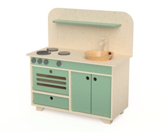 May include: A wooden play kitchen with a light green sink, stove, and cabinets. The stove has four black burners and a small oven. The sink has a wooden faucet and a light brown bowl.