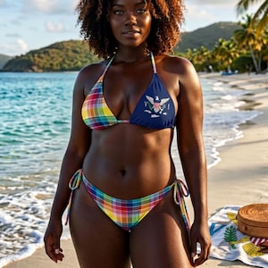 May include: A two-piece bikini featuring a multi-colored plaid pattern on the left cup and bottom, and a solid navy blue right cup with a white eagle emblem. The bikini top has thin straps and the bottom features side ties for an adjustable fit.