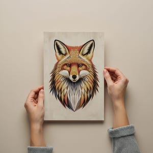 May include: A colourful illustration of a fox's head with intricate geometric patterns in shades of orange, red, yellow, and blue.