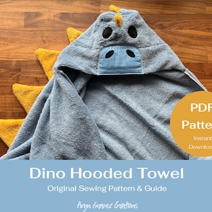 May include: A blue hooded towel with a dinosaur head design. The towel has yellow spikes and a blue face with black eyes. The text "PDF Pattern Instant Download" is on a yellow circle in the lower right corner. The text "Dino Hooded Towel Original Sewing Pattern & Guide Aryn Grause Creations" is at the bottom of the image.