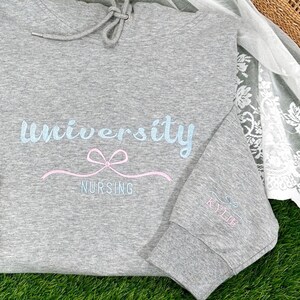 Custom Embroidered University Hoodie | Coquette Bow Sweatshirt | Unique Graduation Gift | College & High School Apparel