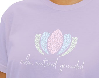 Women's Boxy T-Shirt with Pastel Patterned Lotus Mark and "calm, centered, grounded" on Front; "breathe" on back