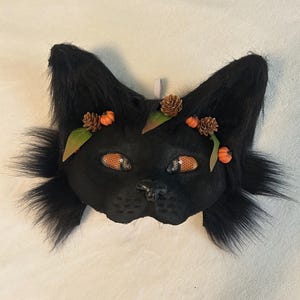 Máscara de gato negro de otoño