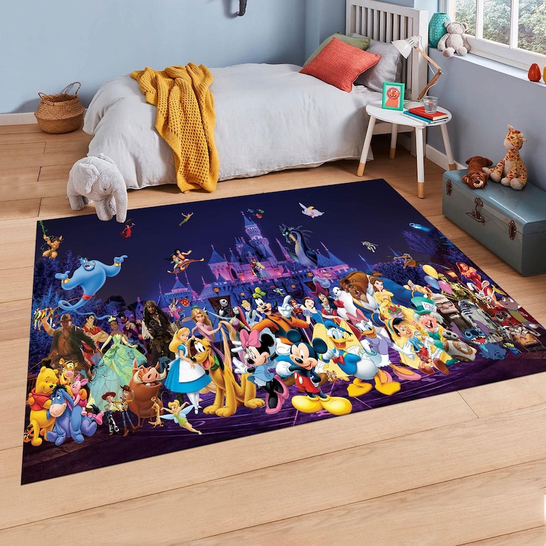 May include: A rectangular rug with a dark blue background, showcasing a colourful collage of Disney characters. The design includes Mickey Mouse, Cinderella, and Genie, with a castle silhouette. The rug is placed on a wooden floor.
