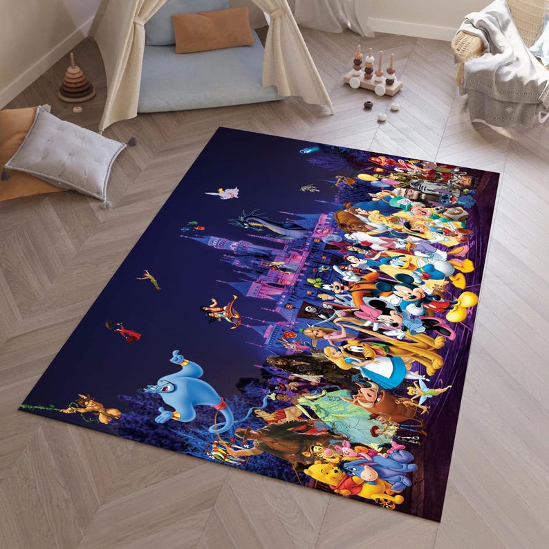 May include: A rectangular rug with a colourful illustration of Disney characters. The design features a castle, Genie, Mickey Mouse, and other characters against a dark blue backdrop. The rug is positioned on a light-coloured wooden floor.