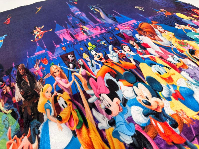 May include: A colourful textile featuring a collage of Disney characters. The design includes Mickey and Minnie Mouse, princesses, and other iconic figures, set against a backdrop of a castle and a starry sky.