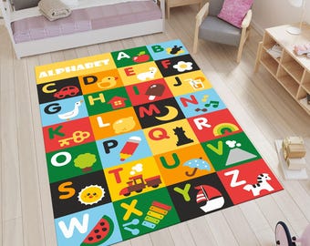 May include: A brightly coloured alphabet rug featuring letters A to Z, each within a different square. Each square contains a letter and a related image. The rug is rectangular and is placed on a light wooden floor.