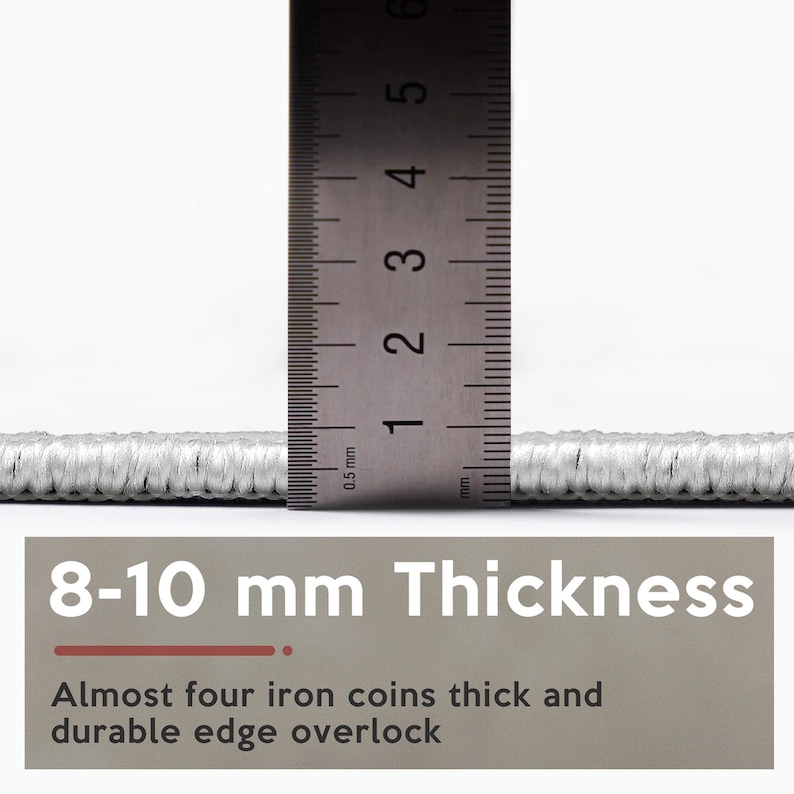 May include: A close-up of a light grey rug with a ruler indicating a thickness of 8-10 mm. The image text states "8-10 mm Thickness" and "Almost four iron coins thick and durable edge overlock."