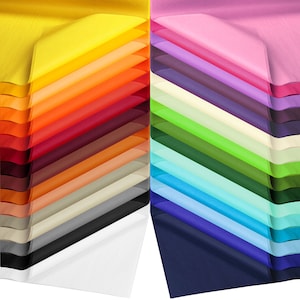 May include: A stack of colourful tissue paper in various shades of yellow, orange, red, brown, beige, grey, black, white, pink, purple, cream, green, blue, and navy. The tissue paper is arranged in a fan shape, with the colours alternating.