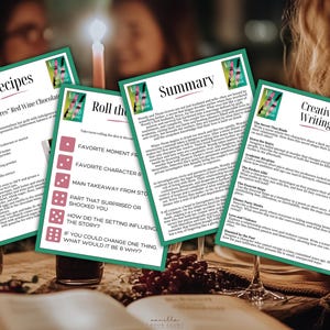 May include: Four green cards with text on a table, including recipes for "Guilty Pleasures" Red Wine Chocolate Cake, discussion prompts, and creative writing prompts. The cards are arranged around a lit candle and wine glasses.