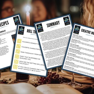 May include: Four printed cards with text and book covers are displayed on a table with wine glasses and a candle. The cards include recipes, a summary, creative writing prompts, and discussion questions. The book cover features a dark blue background with white text.