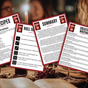 May include: Four red-bordered cards with text, including "Recipes," "Summary," "Roll the Dice," and "Creative Writing." The cards are on a table with wine glasses and a book. The "Recipes" card lists ingredients for Bloody Red Velvet Cupcakes.