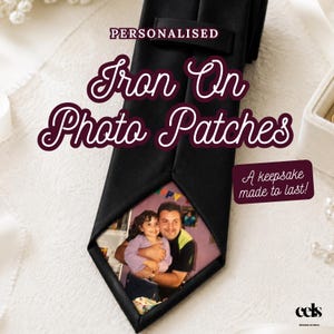 May include: Black tie with a photo patch showing a picture of a man and a child. The text "PERSONALISED Iron On Photo Patches" is in a decorative font. The phrase "A keepsake made to last!" is also visible.