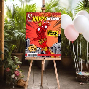 May include: A red and yellow comic book style birthday party sign featuring Iron Man. The sign says "Welcome Happy Birthday Raphael 8 Years!" and has a time of 4 PM to 6 PM.