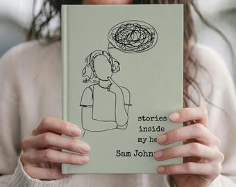 May include: A light green journal with a line drawing of a person thinking, with a thought bubble above their head filled with scribbles. The text "stories inside my head" and the author's name, Sam John, are printed on the cover.