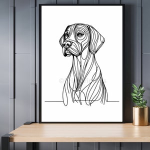 Op de afbeelding: Zwart-witte lijntekening van een hondenkop en schouders. De hond kijkt naar links in de afbeelding. De print is op wit papier en ingelijst in een zwart frame.