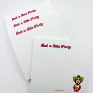 May include: A stack of white notepad paper with the text "Just a little Posty" printed in pink on each sheet. The bottom sheet features a cartoon illustration of a person wearing a cowboy hat and a red shirt.
