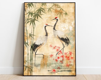 Puede incluir: Una impresión artística enmarcada con dos grullas japonesas con coronas rojas, cerca de hojas de arce rojas y tallos de bambú. El fondo tiene un efecto acuarela beige y verde, con detalles florales blancos.