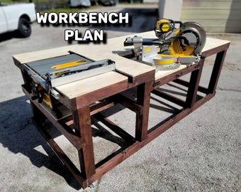 May include: A wooden workbench with a table saw and a mitre saw mounted on top. The workbench is stained a dark brown colour and has a plywood top. The workbench is labelled "WORKBENCH PLAN".