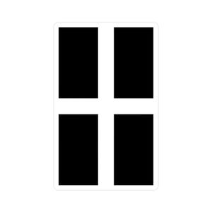 May include: A rectangular sticker featuring the flag of Cornwall, England. The design consists of a white cross on a black background, with the cross dividing the rectangle into four quadrants.