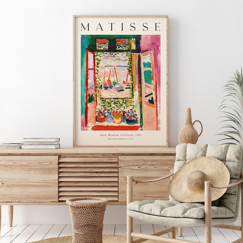 May include: A poster featuring a painting by Henri Matisse titled "Open Window, Collioure, 1905". The painting depicts a colorful view of a harbor with boats through an open window. The poster includes the artist's name, the painting's title, and the year it was created.