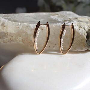 Vintage pearl loop earrings with boho oval hoops make a statement, perfect for wedding jewelry, rhodium plated small pearls, unique gift
