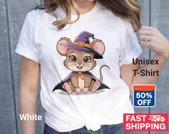 May include: White unisex t-shirt featuring a cartoon mouse dressed as a witch, wearing a purple hat and cape. The shirt has the words "Unisex T-Shirt" printed on it. The shirt is made of a soft, comfortable material.