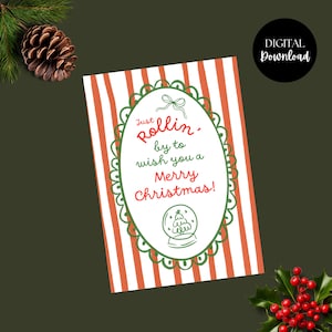 May include: A Christmas card with red and white striped background and a green scalloped oval frame. The text reads "Just rollin' by to wish you a Merry Christmas!" with a snow globe illustration. A digital download.