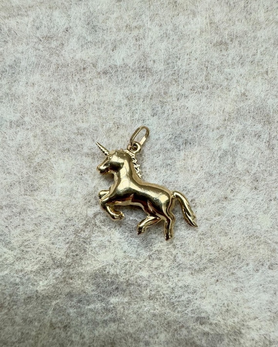 Antique 9ct gold unicorn pendant