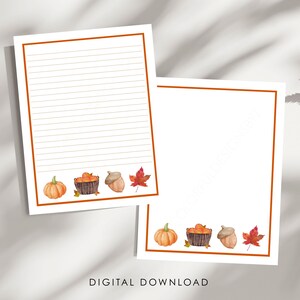 Può includere: Due fogli di carta da lettere con bordo arancione e illustrazioni ad acquerello di una zucca, un cesto di mele, una ghianda e una foglia d'acero rossa sul fondo. Un foglio presenta righe orizzontali, mentre l'altro è completamente bianco.