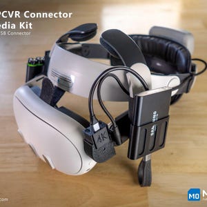 May include: A white and black VR headset with a black USB connector and a black Samsung storage device. The text "M10 PCVR Connector 4K Media Kit" is visible. The image also shows the text "Reinforced USB Connector".