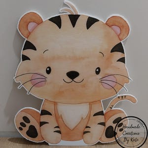 May include: A watercolour illustration of a cute cartoon tiger sitting with its paws in front of it. The tiger is orange and black with pink cheeks and a white belly. The tiger is sitting on a white background.