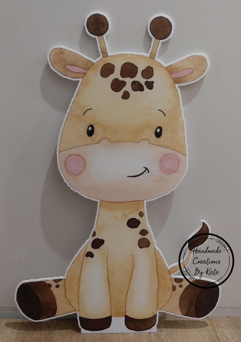 May include: A watercolour illustration of a cute giraffe with brown spots. The giraffe is sitting down with its legs crossed and has a big smile on its face. The illustration is on a white background.