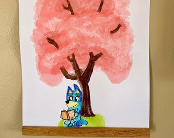 Bluey Reading Under A Tree
