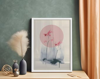 May include: A framed art print featuring a pink circle and stylized pink flowers on black stems. The artwork has a watercolor effect with blue and gray washes. The print is in a white frame, displayed on a wooden surface.