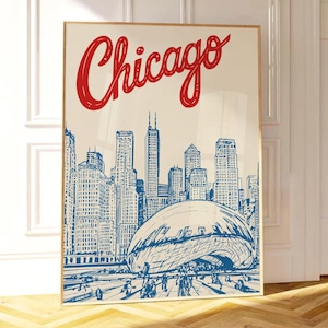 Puede incluir: Una impresión artística enmarcada con una ilustración azul y blanca del horizonte de Chicago, con la palabra "Chicago" en rojo. La impresión incluye la icónica escultura Cloud Gate.
