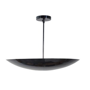 May include: A black pendant light fixture with a wide, shallow, saucer-shaped shade.
