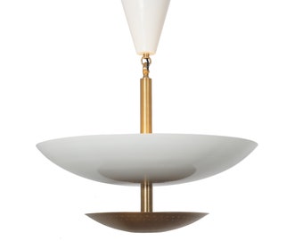 May include: A modern white and brass pendant light fixture. The fixture features a white conical top, a brass rod, and a large, shallow white bowl-shaped shade. A smaller, perforated bronze-colored shade is below.